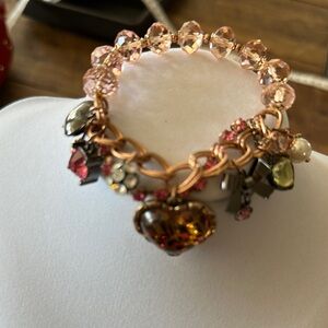Betsey Johnson Pink and Gold Charm Bracelet with Intricate Details